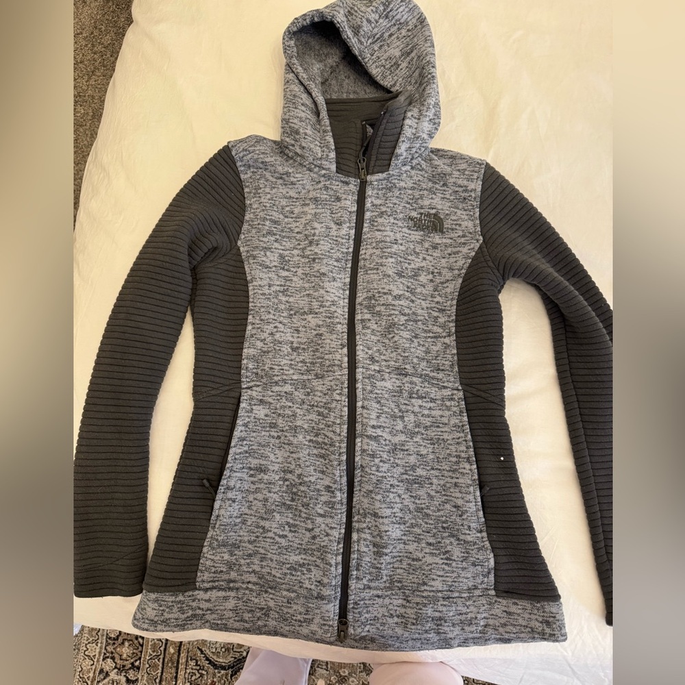 The North Face jacket maybe used once in like new quality. Really warm material